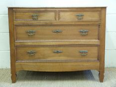 A stained ash and fruit wood chest of two over three drawers,