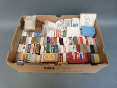 A collection of approximately 150 packs of playing cards to include Victorian, Bezique,