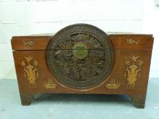 An oriental chest with domed top