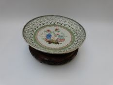 A 19thC Chinese pierced shallow bowl with central decoration of vases and peonies,