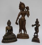 Two brass / bronze Thai or Tibetan figures and a larger brass Tibetan figure,