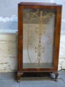 A retro glazed display cabinet,