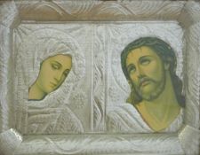 A framed icon mounted with nickel or similar embossed decoration.