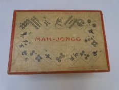 A boxed wooden Mah-Jong set