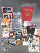 A collection of film and TV memorabilia including Mr Bean's bear and Twelve Weeks in Hong Kong by