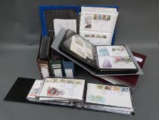 Seven albums of GB first day covers, large quantity, includes duplicates,