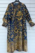 A late 19th/20thC Chinese silk coat decorated in gold thread with dragons and auspicious symbols