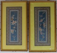 A pair of 19thC framed Chinese embroidered cuffs with decoration of birds and flowers
