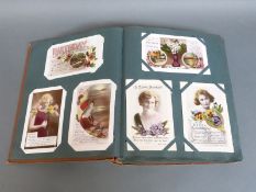 An album of largely Edwardian postcards to include glamour, flowers, early greetings, children,