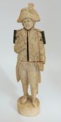 A 19thC Dieppe ivory figure of Nelson in Naval dress, opening to reveal a scene depicting his,