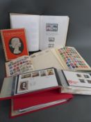 Three albums of all-world stamps and two albums of first day covers