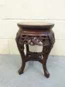 A Chinese carved hardwood side table with red marble top, 46 x 30.