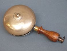 A 19thC or early 20thC brass twin dome hand bell