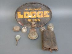 A quantity of Model T Ford and other radiator and hub caps including a horse drawn vehicle cap with