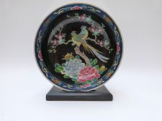A late 19th / 20thC Chinese famille noir pedestal bowl decorated with birds of paradise in prunus