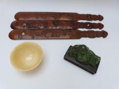 Three Chinese carved wooden page turners length 43cm,