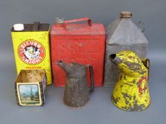 A quantity of vintage oil and petrol cans including Shell 2 gallon example,