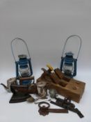 A pair of painted hurricane lamps, planes,