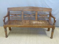 A bench or settle with pierced back,