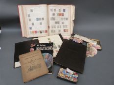 An Ideal stamp album and other albums, ring binders and loose stamps.