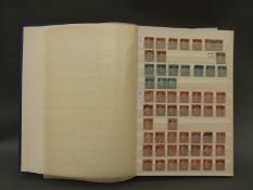 A stockbook containing a large quantity of GB stamps from Victoria to Queen Elizabeth II
