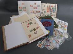 A box of West, East and South African stamps, loose and in albums, including covers.