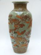 An oriental crackle glaze vase with raised floral and bird decoration,