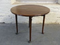 A small Georgian mahogany drop leaf table raised on tapering legs with pad feet,
