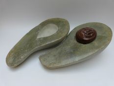 A carved Shona two part avocado with carved stone within,