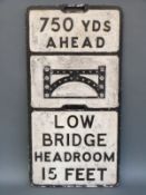 A vintage 'low bridge 750yds ahead' road sign with bullseye reflectors and Stockport maker's name