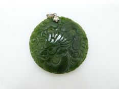 A carved nephrite jade pendant in the form of a dragon, verso a phoenix, 4.