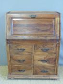 An Eatern hardwood bureau, the fall flap opening to reveal fitted interior,