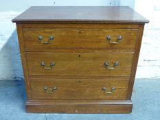 A late 19thC/early 20thC oak chest of three drawers,
