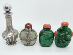 A Chinese malachite scent bottle carved in relief depicting a dragon with coral stopper and coral