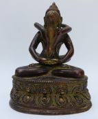 A Tibetan/ Nepalese Yab-Yum or Shiva Shakti brass figural model,