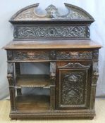 A 19thC carved oak sideboard with two drawers above shelves and cupboard,