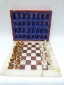 An alabaster chess set, height of king 7.