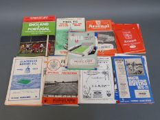 A collection of c1950's football programmes, including Arsenal, Wolverhampton, Rotherham, West Ham,