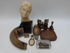 A quantity of 19thC and later photograph frames, opera glasses, tusk, stone bust,