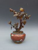 A 19thC cloisonné jardiniere with blue, green and yellow decoration on a red ground,