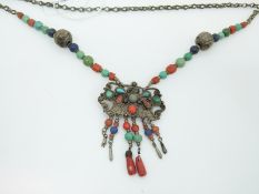 A white metal Tibetan/ Nepalese necklace set with turquoise,