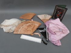 A mother-of-pearl inlaid lacquer book cover, boxed wooden fans,