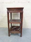 A Chinese side table with a pierced shelf below and single drawer,