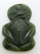 A nephrite jade Maori tiki, approximately 3.2 x 2.