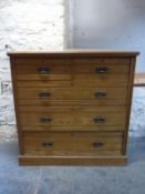 A 19thC ash chest of two over three graduated drawers,
