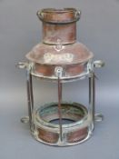 A copper ship's anchor lamp,