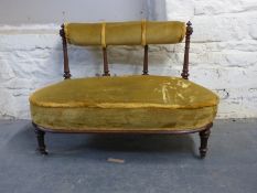 A 19thC or early 20thC salon sofa with turned and carved legs and back,