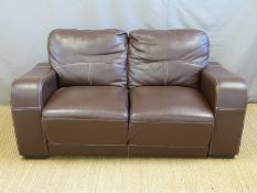 A contemporary leather two-seater sofa