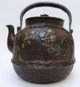 A Chinese iron teapot with gilt inlaid decoration depicting flowers,