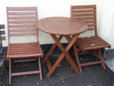 A garden table and two chairs